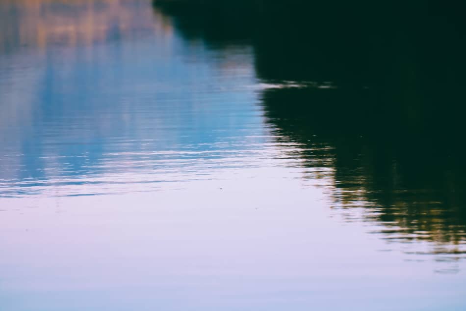Gentle ripples moving across the surface of a calm lake