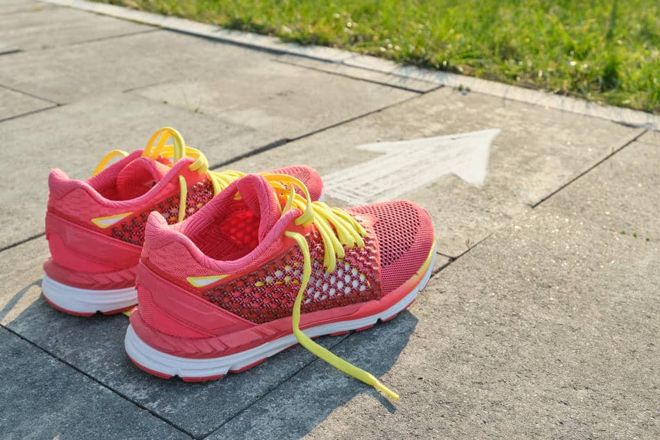 Running shoes placed and ready outdoors, symbolizing how one simple daily system removes unnecessary decisions.